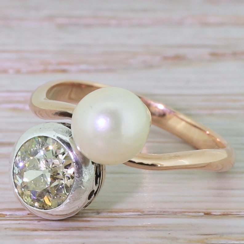 edwardian 115 carat fancy light yellow diamond 038 pearl crossover ring circa 1905